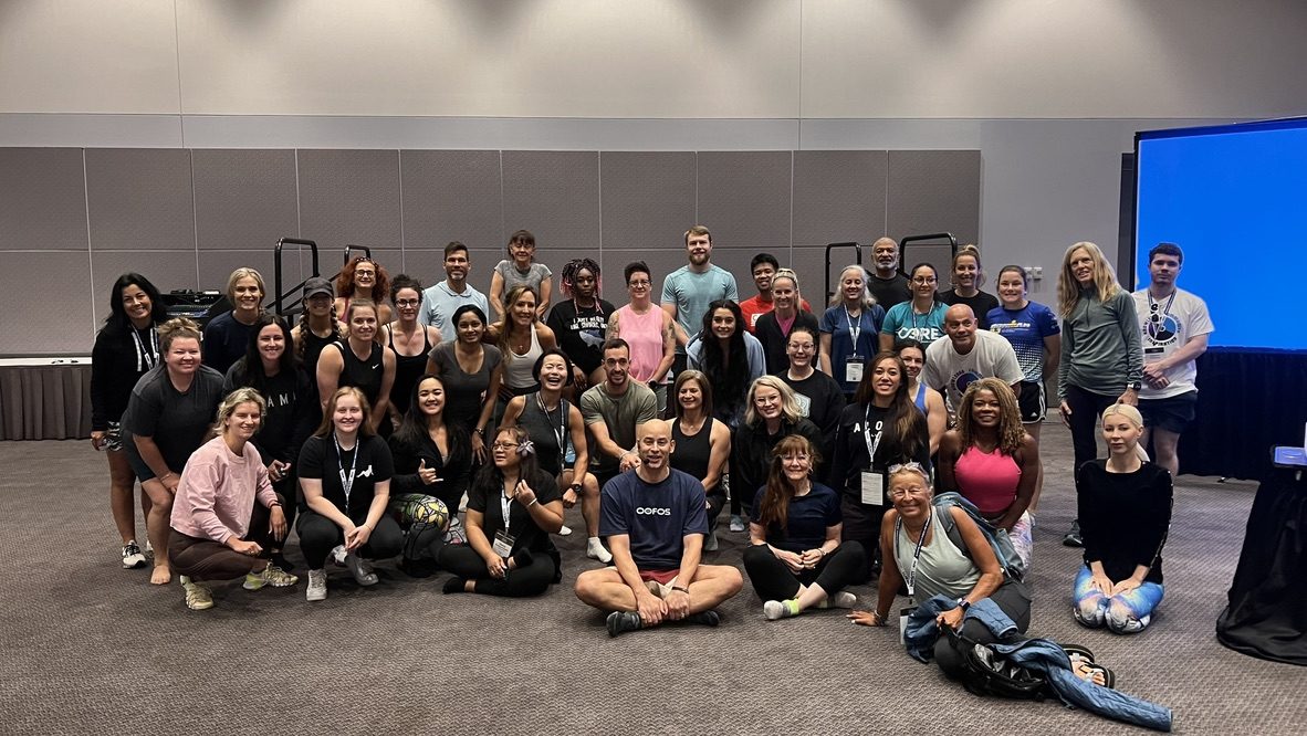 Group photo of fitness professionals after an Active Recovery workshop led by Marc Coronel